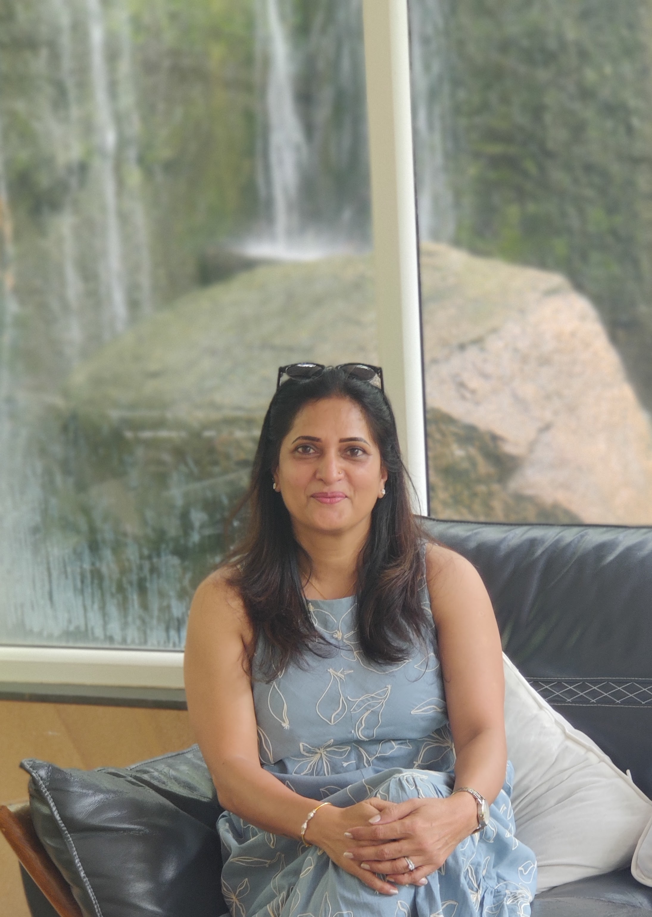 Sri Devi performing an advanced balance yoga pose, demonstrating strength and mindfulness.